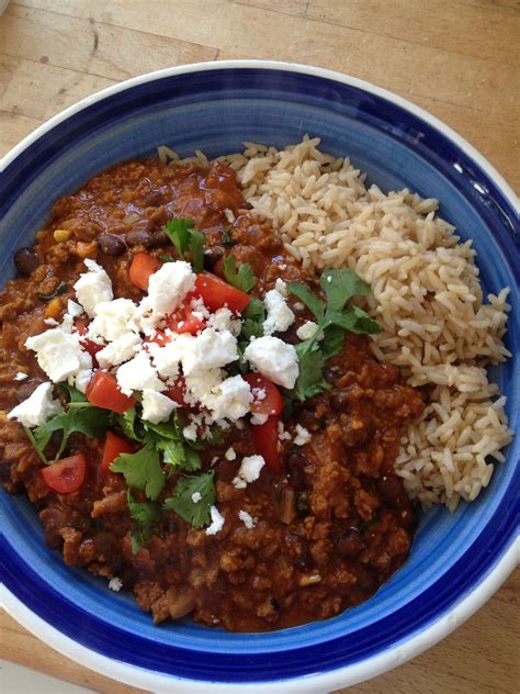 Quorn mince Chili topped with tomatoes, coriander and feta served with ...