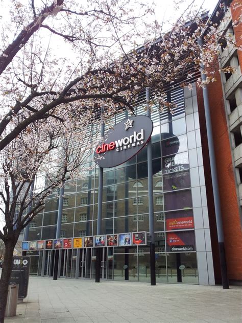 the front of a building with cherry blossoms on it