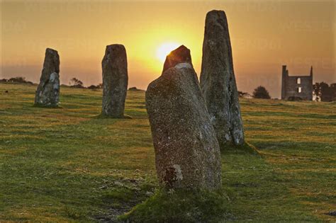 Sunrise over standing stones at the Hurlers, a series of prehistoric ...