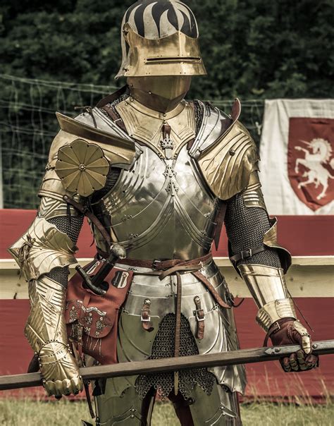 historic style high gothic suit of armour with gilded elements and leather covered sallet ...