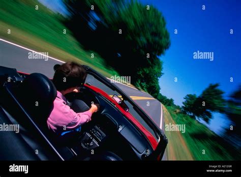 Man driving sports car Stock Photo - Alamy