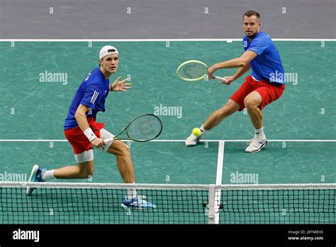 Czech tennis players Jakub Mensik (left), Adam Pavlasek in action ...