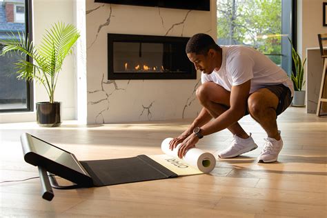 This smart fitness mat has an attached display & webcam to give you ...