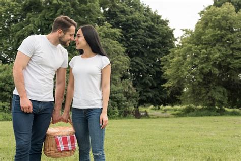 Free Photo | Couple holding a picnic basket