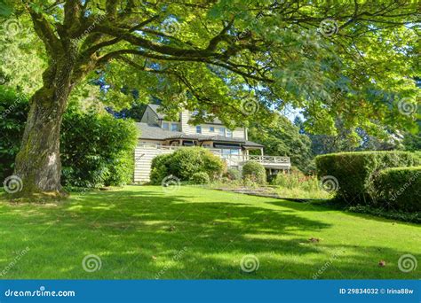 Large Brown House Exterior with Green Summer Garden. Stock Photo - Image of luxury, brown: 29834032