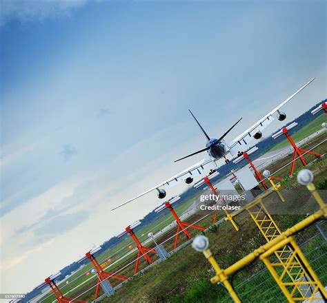 Landing Plane Touching Down High-Res Stock Photo - Getty Images