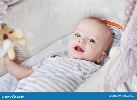 Cute baby boy smiling stock image. Image of baby, crib - 38276731