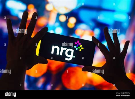 In this photo illustration, the NRG Energy logo is displayed on a ...