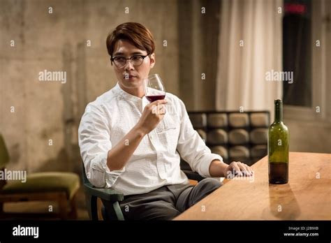 Man drinking wine Stock Photo - Alamy