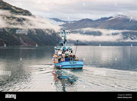 A commercial fishing boats heads out on the Passage Canal in Prince ...