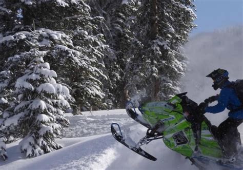 Navigating Difficult Terrain While Snowmobile Racing