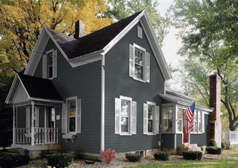 Discover the Allure of a Grey House with Yellow Shutters: Click Here to ...