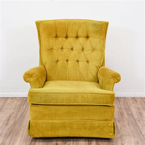 This vintage armchair is upholstered in a soft, yellow-green suede fabric. This retro recliner ...