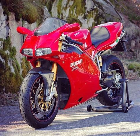 a red ducati motorcycle parked on the street