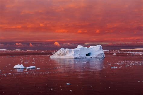 Iceberg in Blood Red Sea, Lemaire Channel, Antarctica by Camille Seaman ...