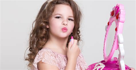 Cute little girl with lipstick applying makeup, glamour kid - Beating ...