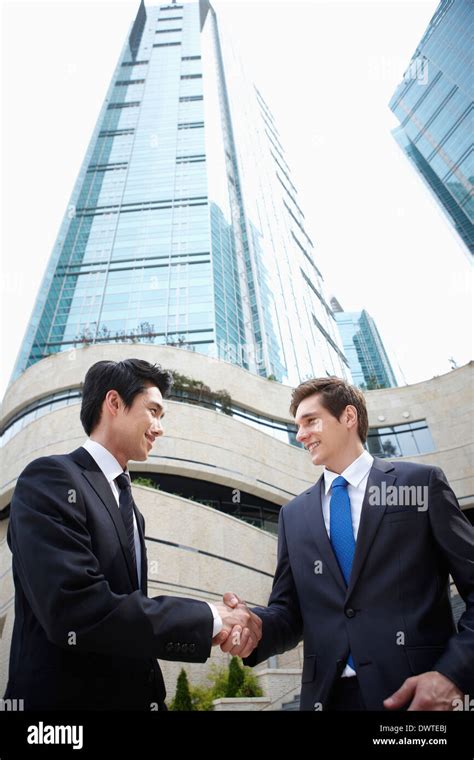 two business men talking outside Stock Photo - Alamy