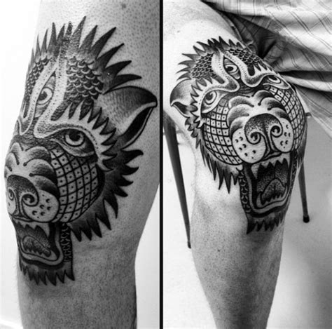 Black ink detailed knee tattoo of demonic dog head - Tattooimages.biz