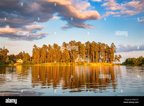 Beautiful sunset on forest lake Stock Photo - Alamy