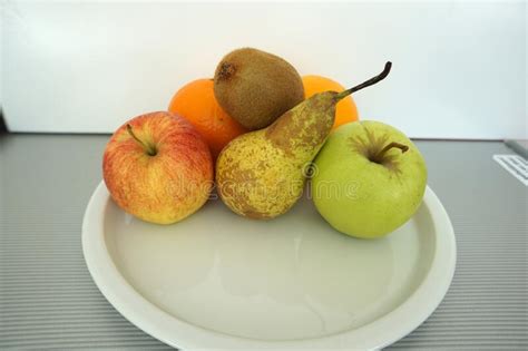 White Plate with Various Fruits on a Kitchen Table Stock Photo - Image of delicious, ripe: 196632392
