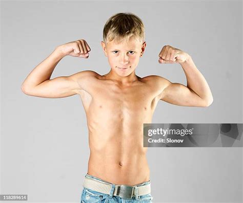 Kid Show Muscle Photos and Premium High Res Pictures - Getty Images