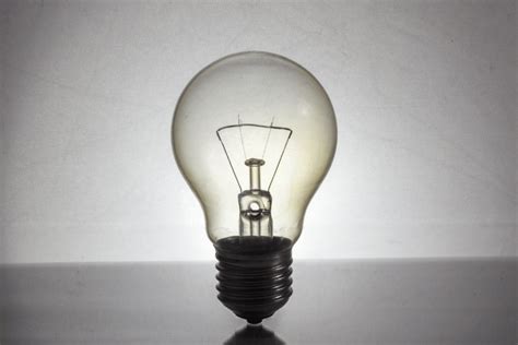 Why incandescent bulbs consume more power?