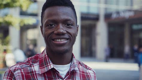 African American man toothy-smiles and looks right at camera Stock ...