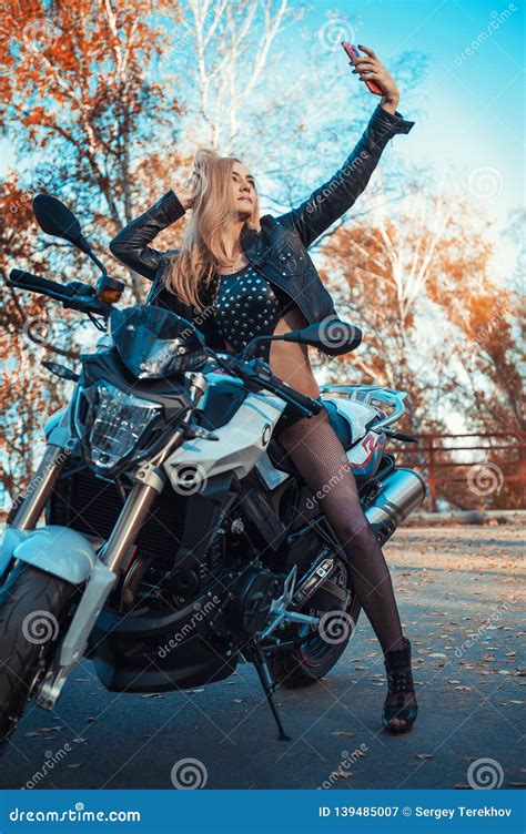 The girl on a motorcycle. stock image. Image of caucasian - 139485007