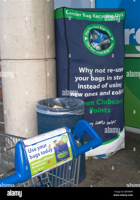 UK Plastic carrier bags recycling bins in Tesco supermarket in Hackney, east London. Photo Julio ...