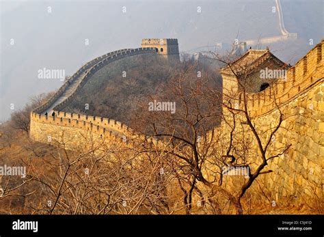 The Great Wall of China with several watchtowers visible in golden late ...