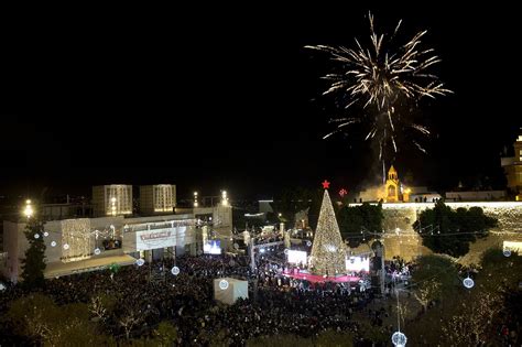 Thousands gather in Bethlehem for Christmas tree lighting | The Times of Israel