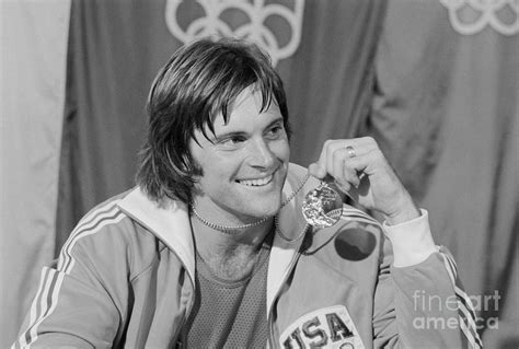 Bruce Jenner Holding His Gold Medal by Bettmann