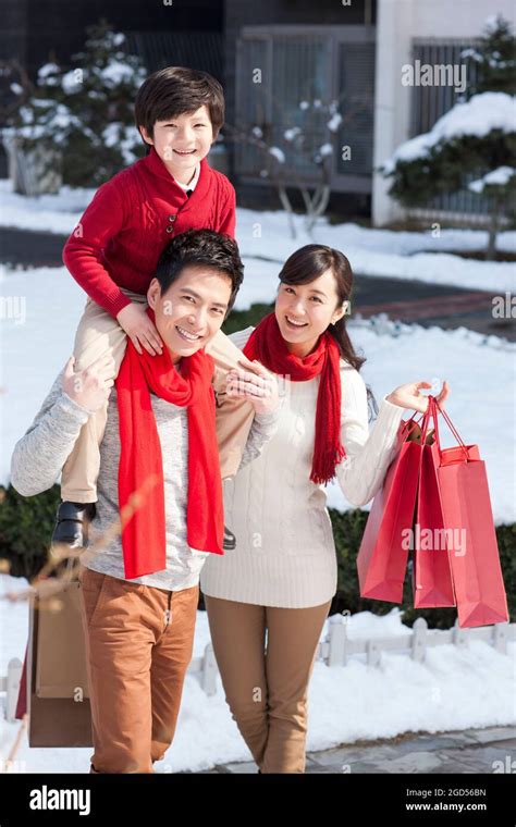 Happy family with new year gifts Stock Photo - Alamy