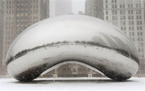 Snow falls on Cloud Gate. February 1, 2011 : r/chicago