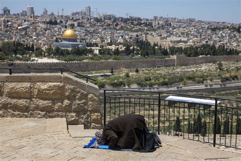 Muslims in Jerusalem pray outdoors amid virus lockdown