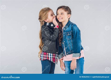 Two Smiling Little Girls Whispering Secrets Stock Photo - Image of friendship, standing: 90362932