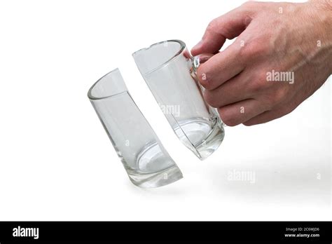 Man holds broken glass cup on white background, incident concept Stock Photo - Alamy