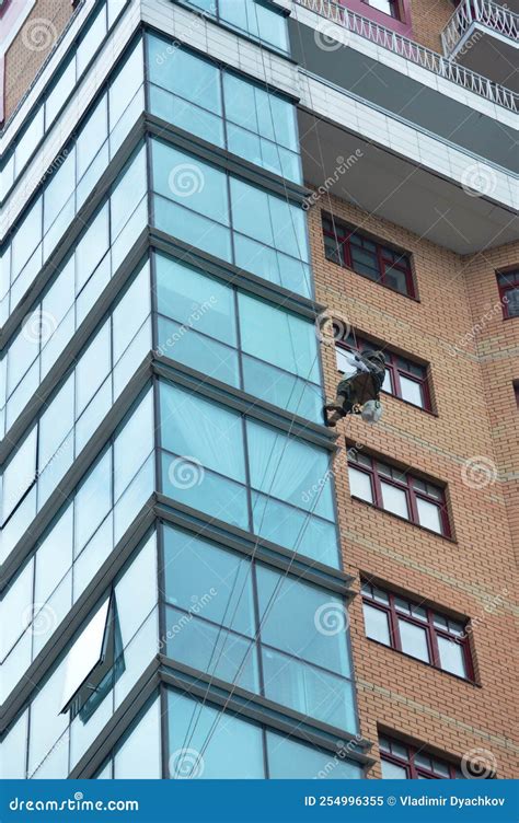 Skyscraper window cleaning stock image. Image of blue - 254996355