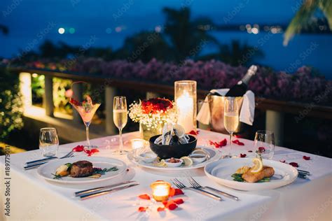 Romantic candlelight dinner luxury table setup for couple with ...