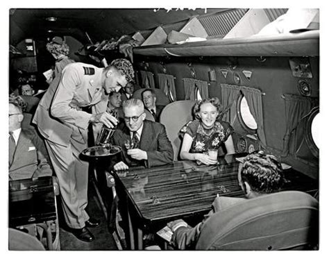 SAA Douglas DC-4 interior filled with passengers. Steward. - Atom site for DRISA