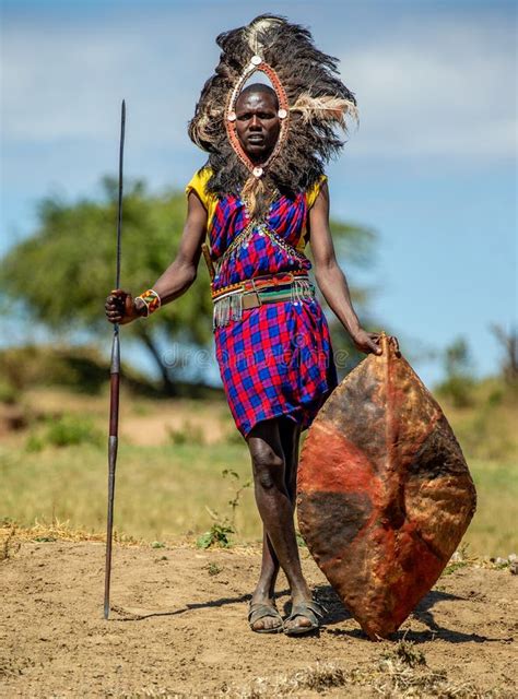 Masai Warrior is Standing in Traditional Clothing in a Warrior`s ...