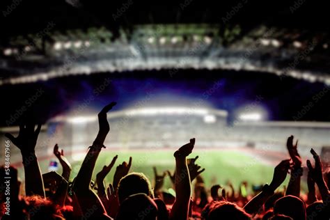 football or soccer fans at a game in a stadium world cup Stock Photo | Adobe Stock