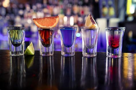 Shots with liquor and alcohol in cocktail bar. Colorful shots coktails on the ba #Sponsored , # ...