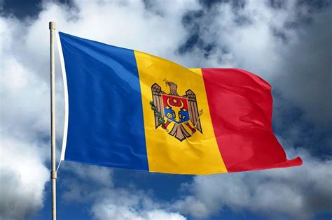 Moldova flag on sky and cloud background national symbols of moldova ...