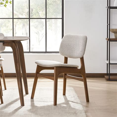 The popular Joshua is a mid-century inspired collection with a curved seat and back, designed ...