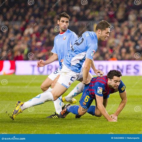 Xavi of FC Barcelona editorial photography. Image of foul - 54634802