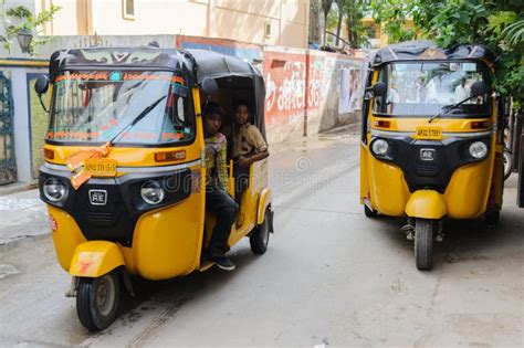 Two Indian Moto Rickshaws Tuk Tuk Going by the Street. 11 February 2018 Puttaparthi, India ...