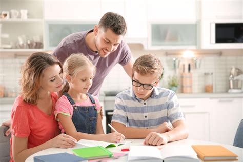 Premium Photo | Children with parents doing homework at home