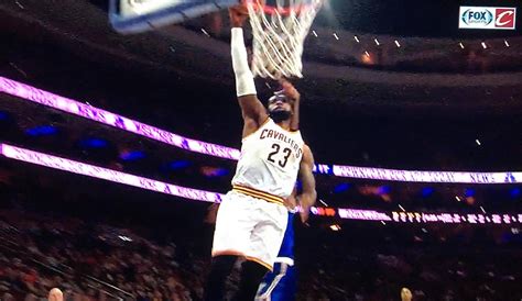 Video: LeBron James dunks ball while getting hit by Joel Embiid