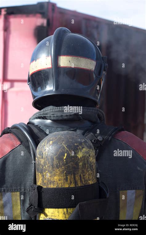 Firefighter putting out fire training station extinguisher backdraft emergency safety drill ...